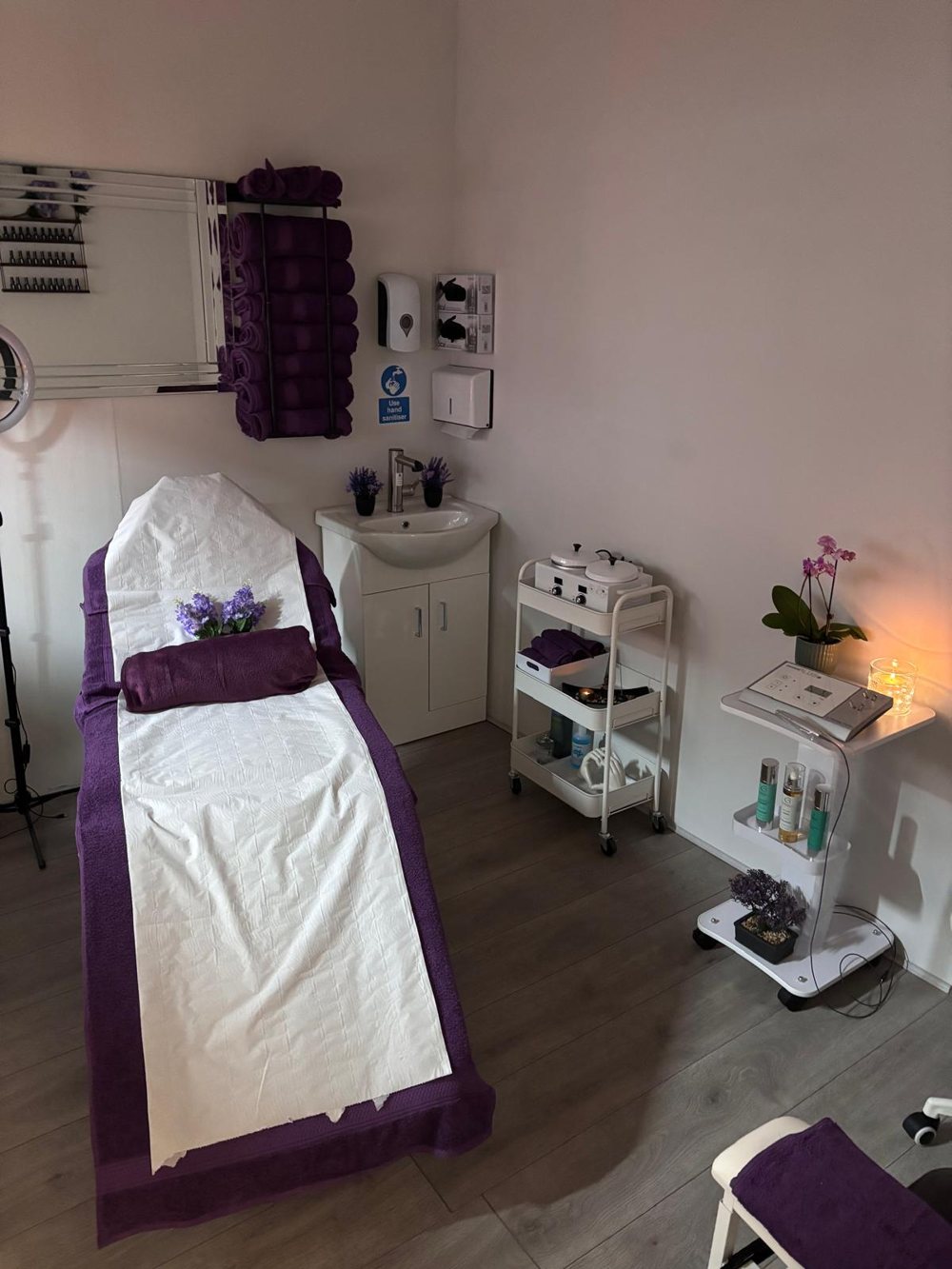 The RX Beauty treatment room, with the couch made up in purple towels