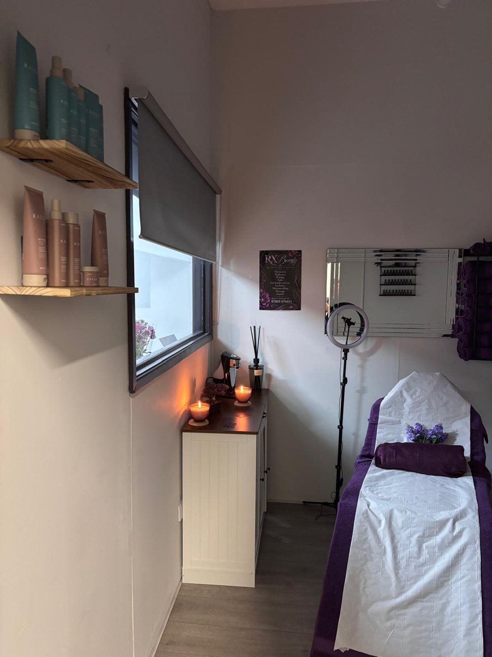 Skincare shelves, candles and the treatment couch